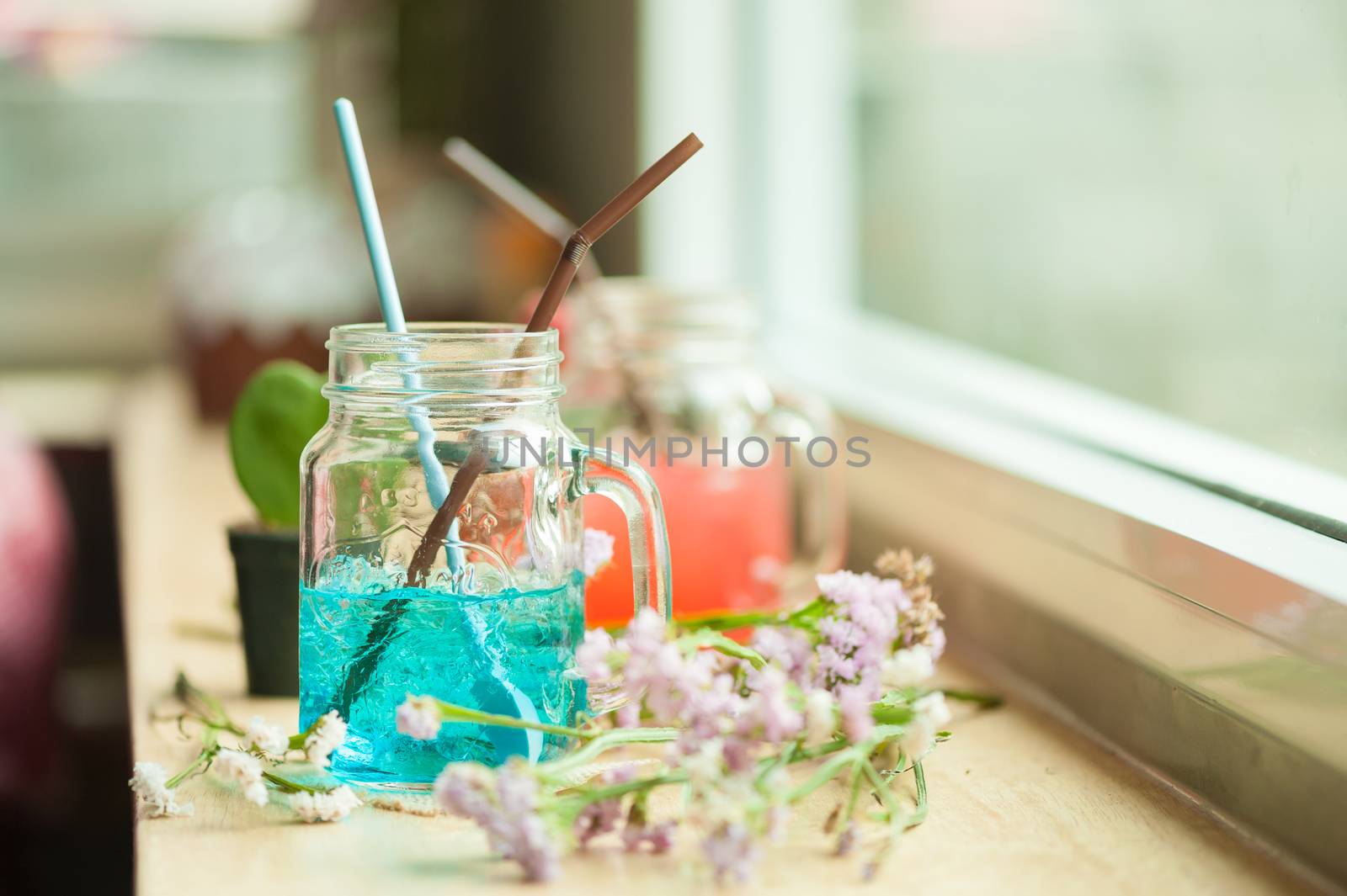 Italian soda on wood bar in cafe