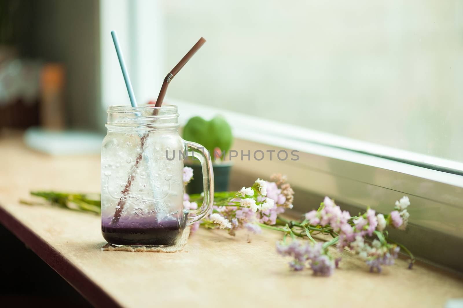 Italian soda on wood bar in cafe