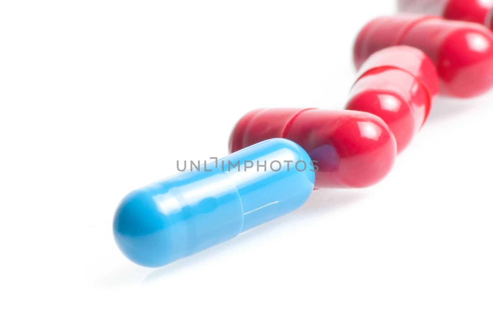 closeup of medical pills in laboratory on white table
