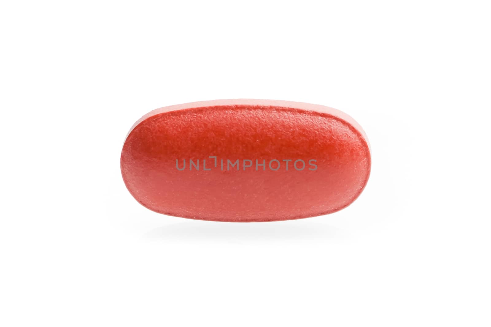 one red medical pill isolated on white background