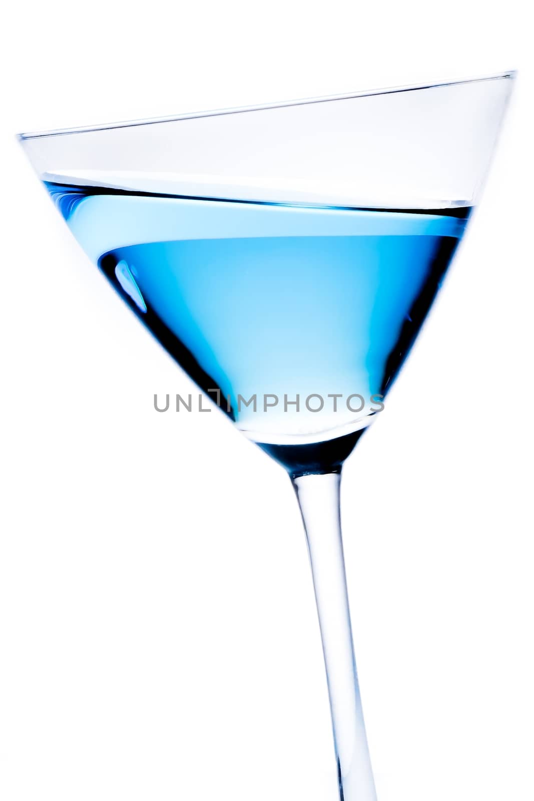 detail of blue cocktail tilted on a white background
