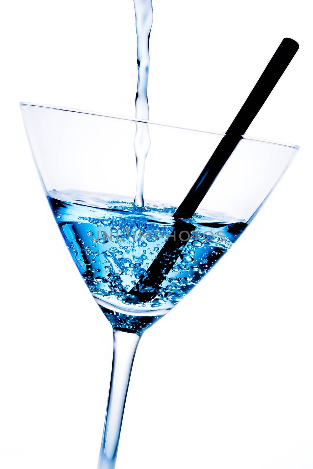 detail of blue cocktail with bubbles and black straw by donfiore