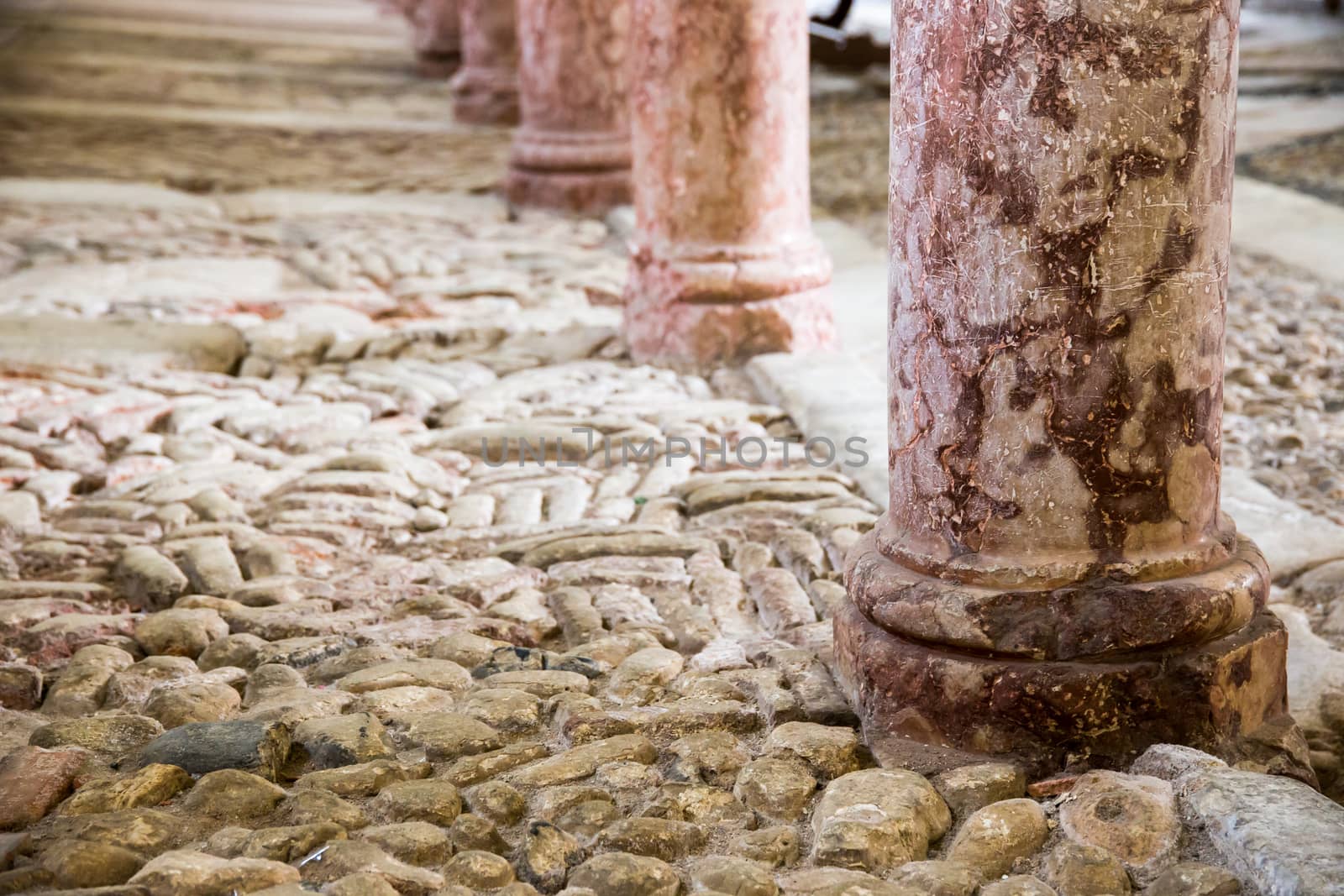 antique marble columns resting on stone floor by Isaac74