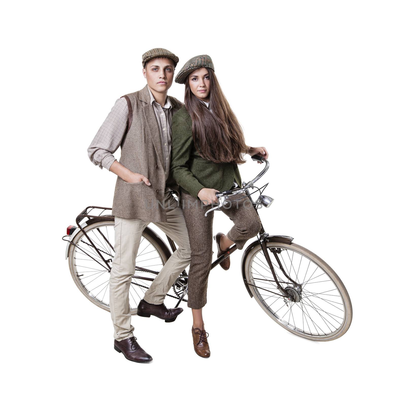 Vintage dressed couple sitting on retro bike