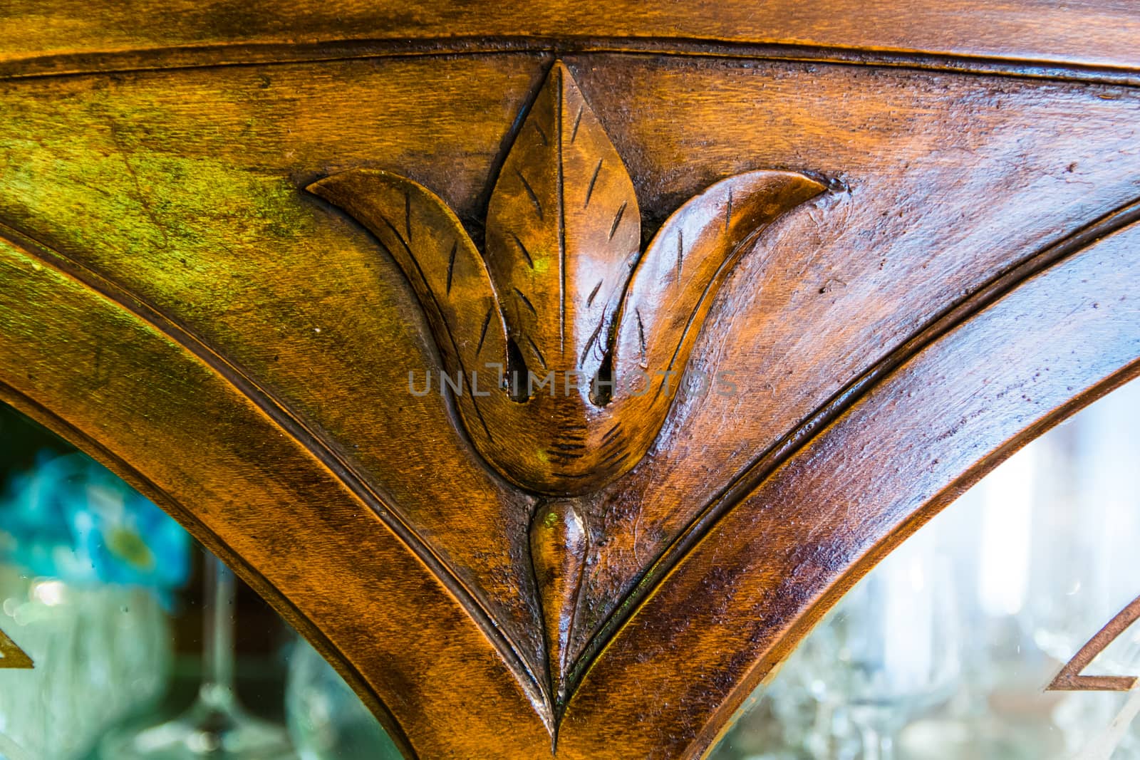 detail of an old carved wood cabinet crystals