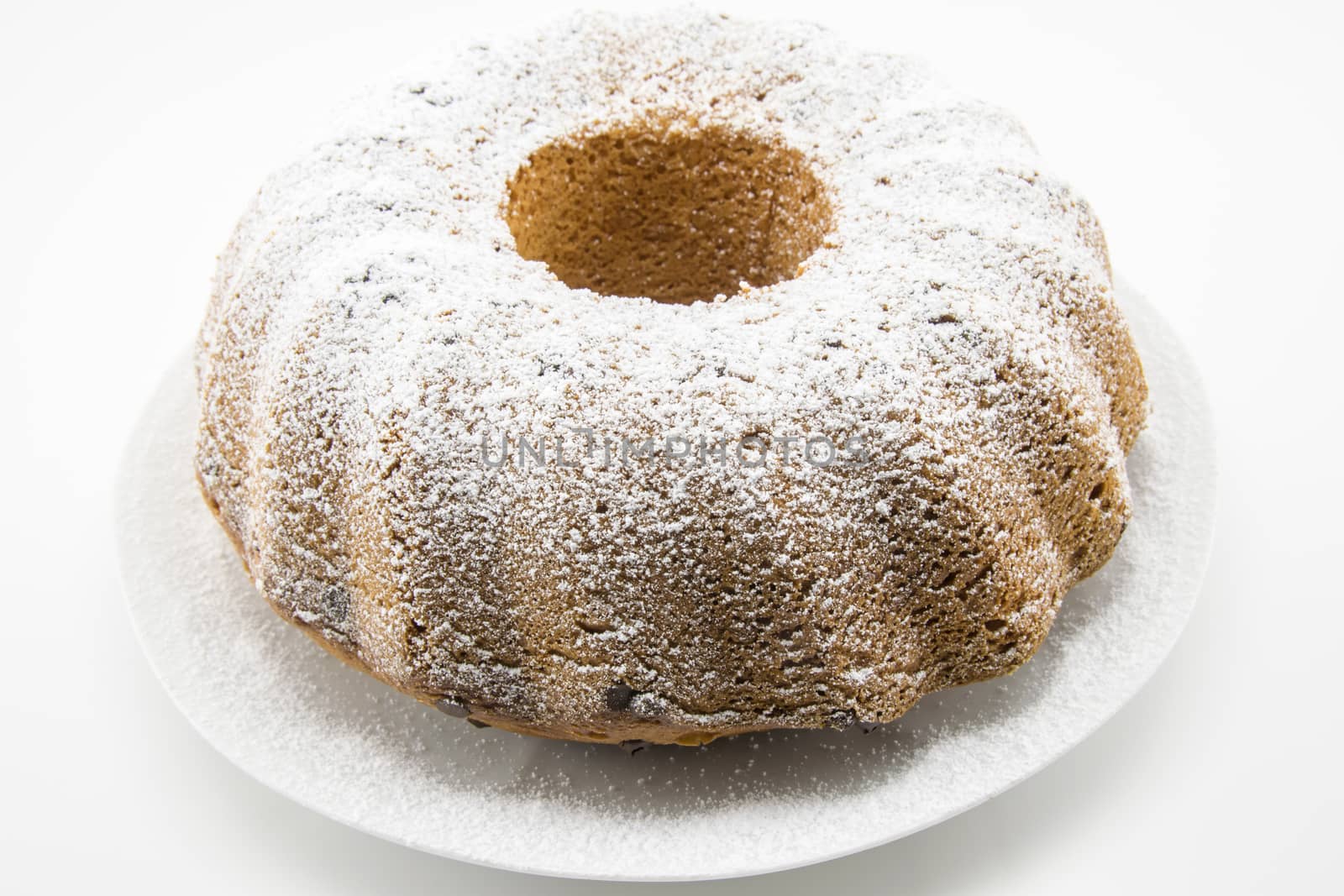 classic italian cake with icing sugar and hole in the center