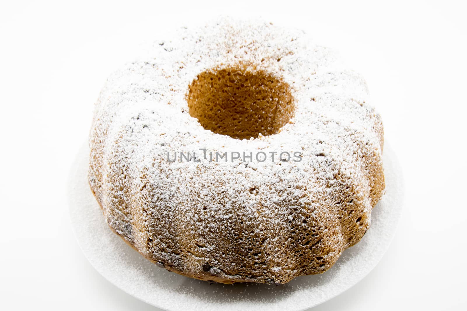 classic italian cake with icing sugar and hole in the center