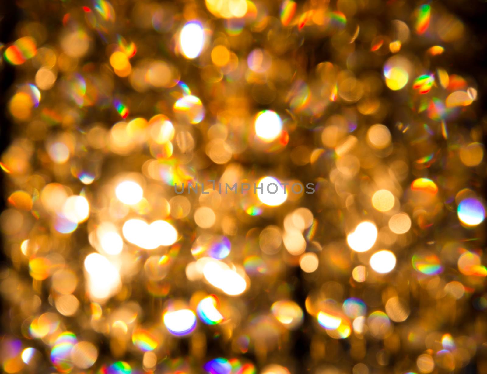 background created by a crystal chandelier that shines with golden light