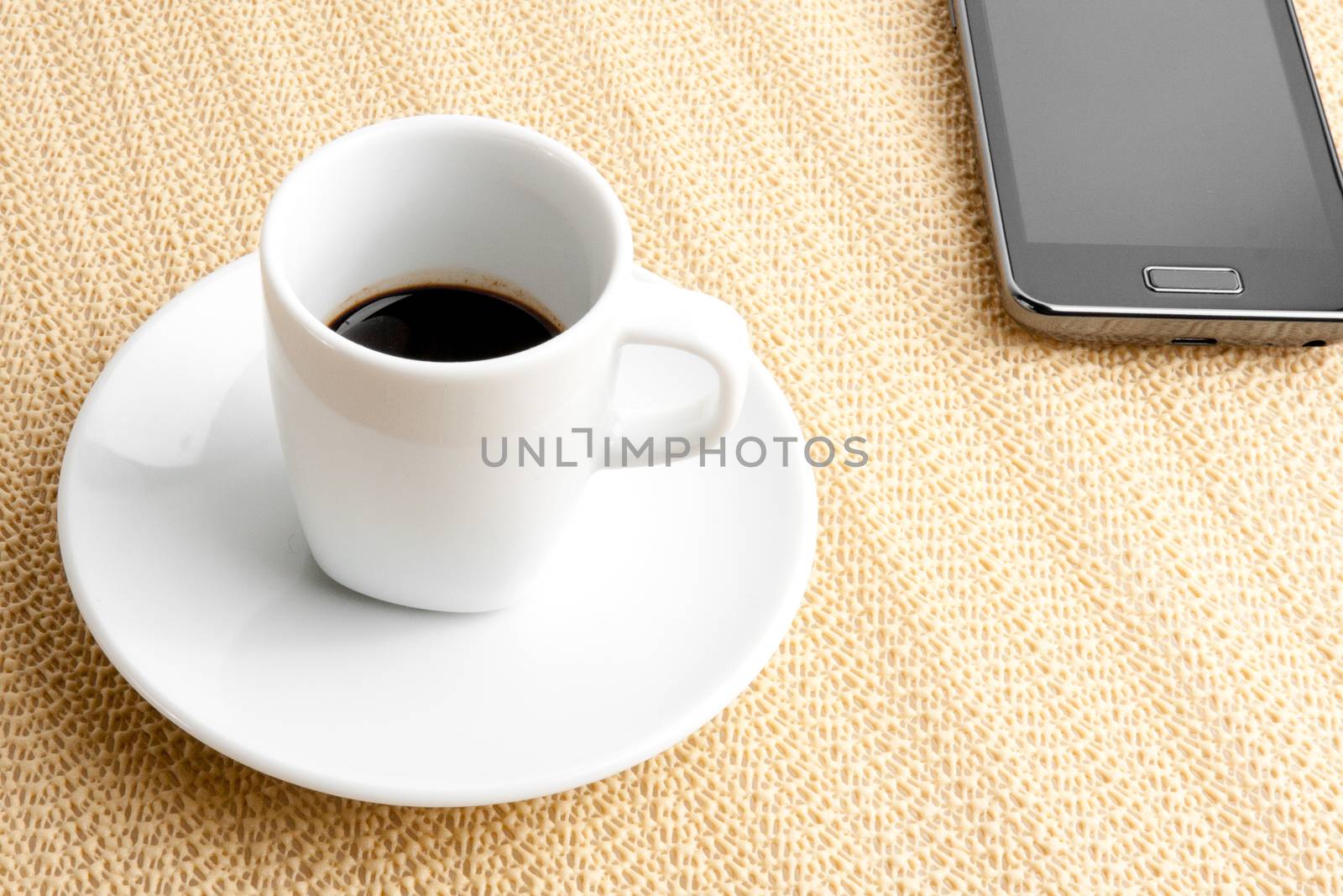 cup of coffee with smartphone by donfiore