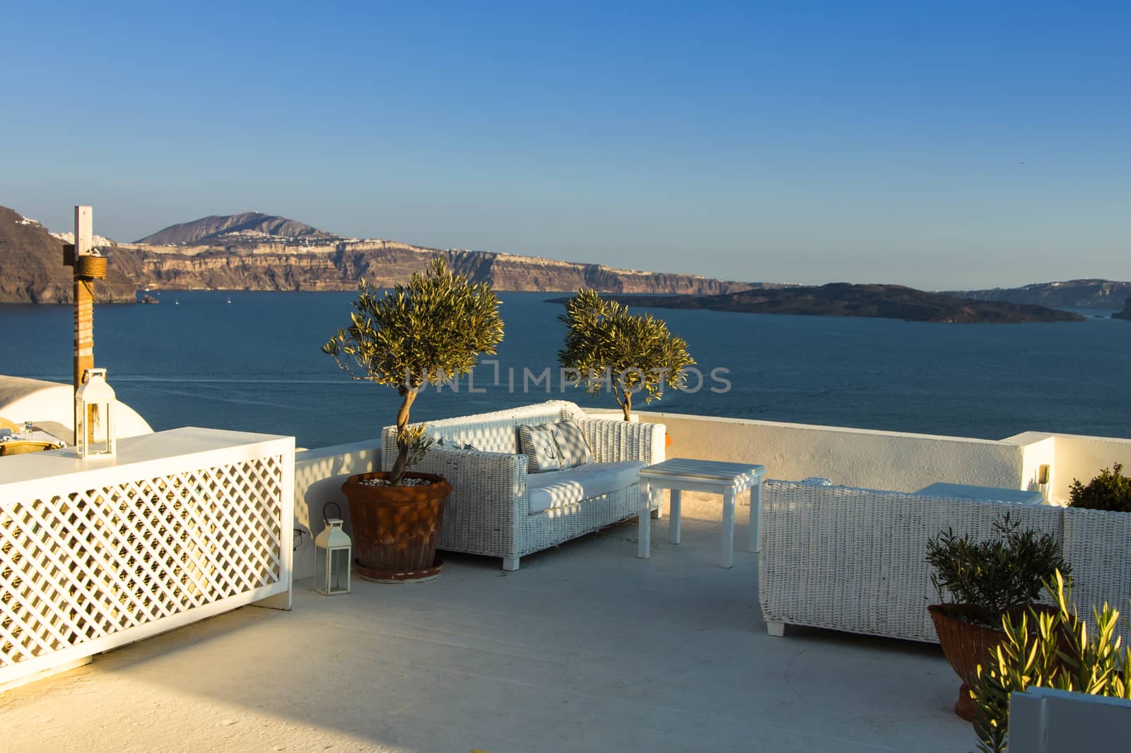 A tranquil terrace under the setting sun in the beautiful greek island