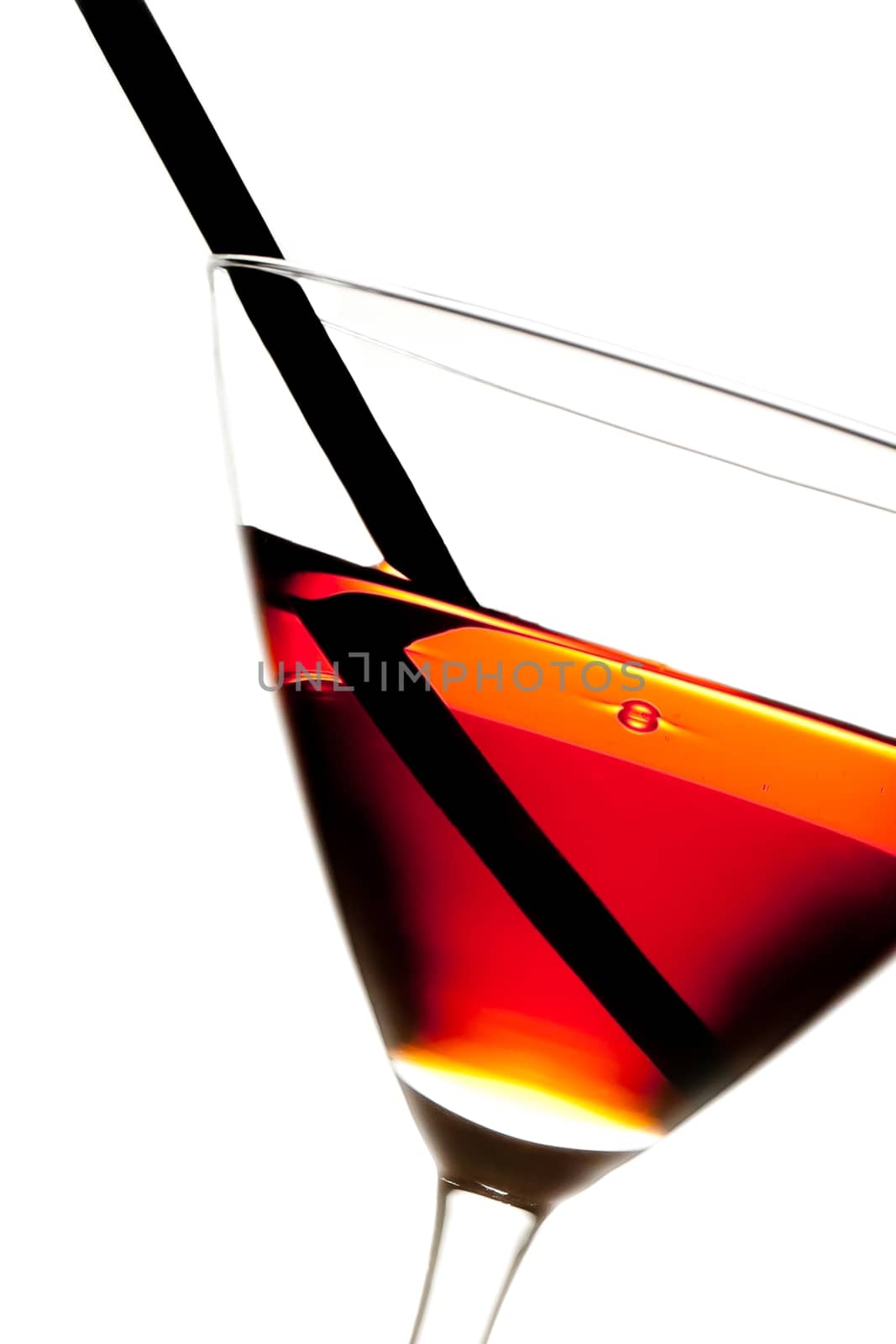red cocktail with straw on white background