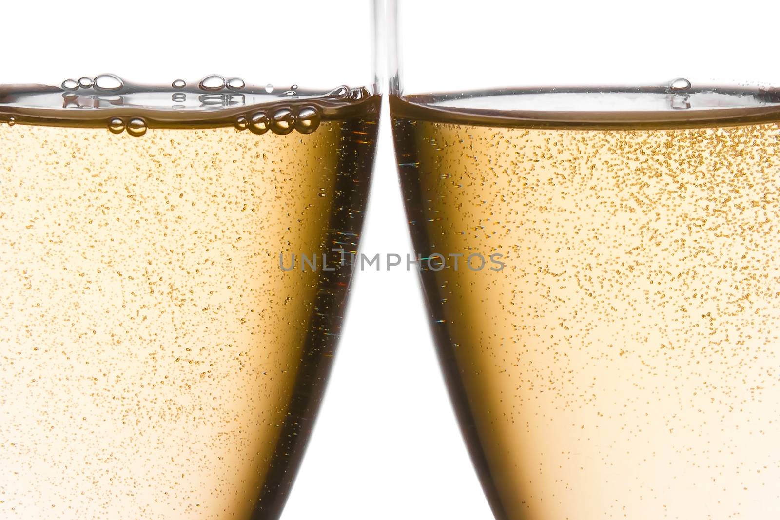 detail of cheers with two champagne glasses with gold bubbles on white background