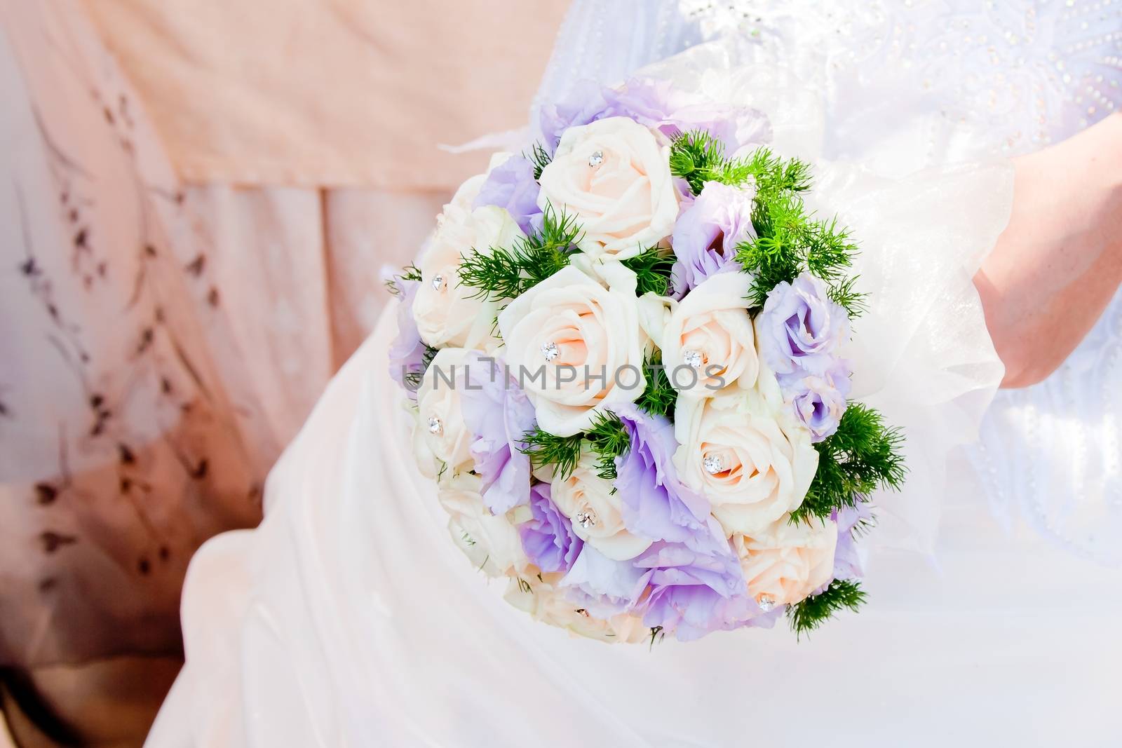 detail of wedding bouquet at bride's hands