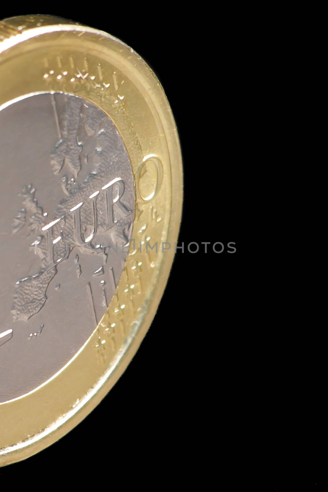 One euro coin isolated on black background