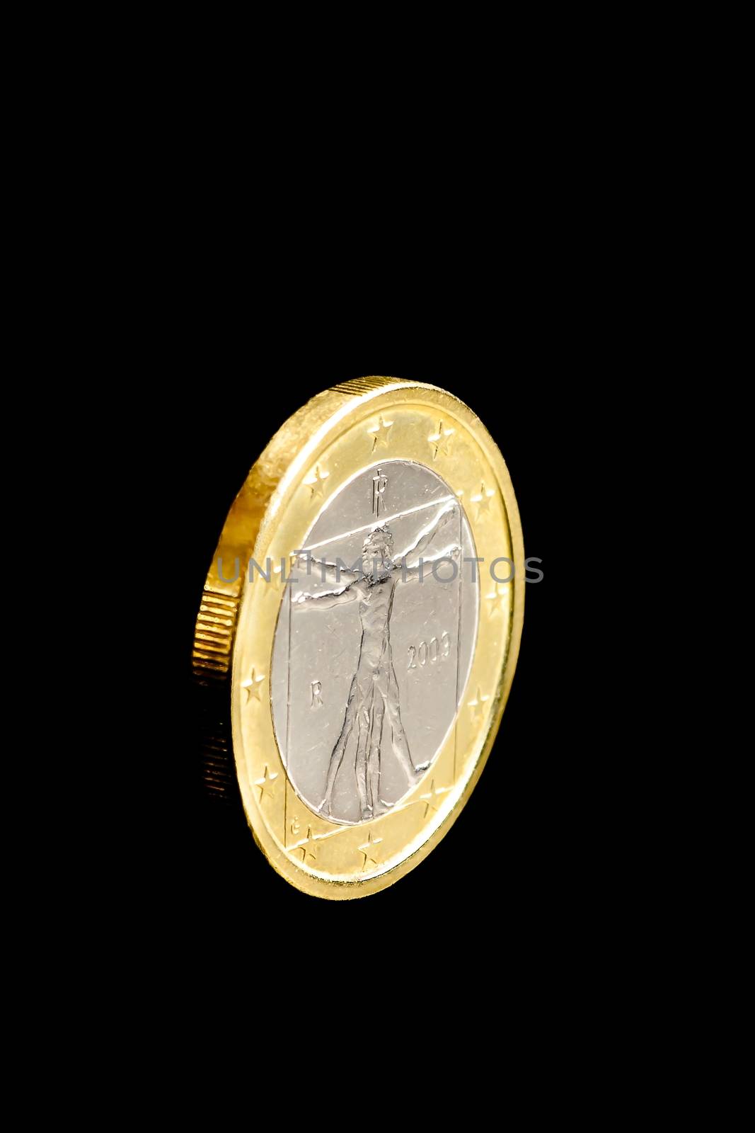 One euro coin isolated on black background