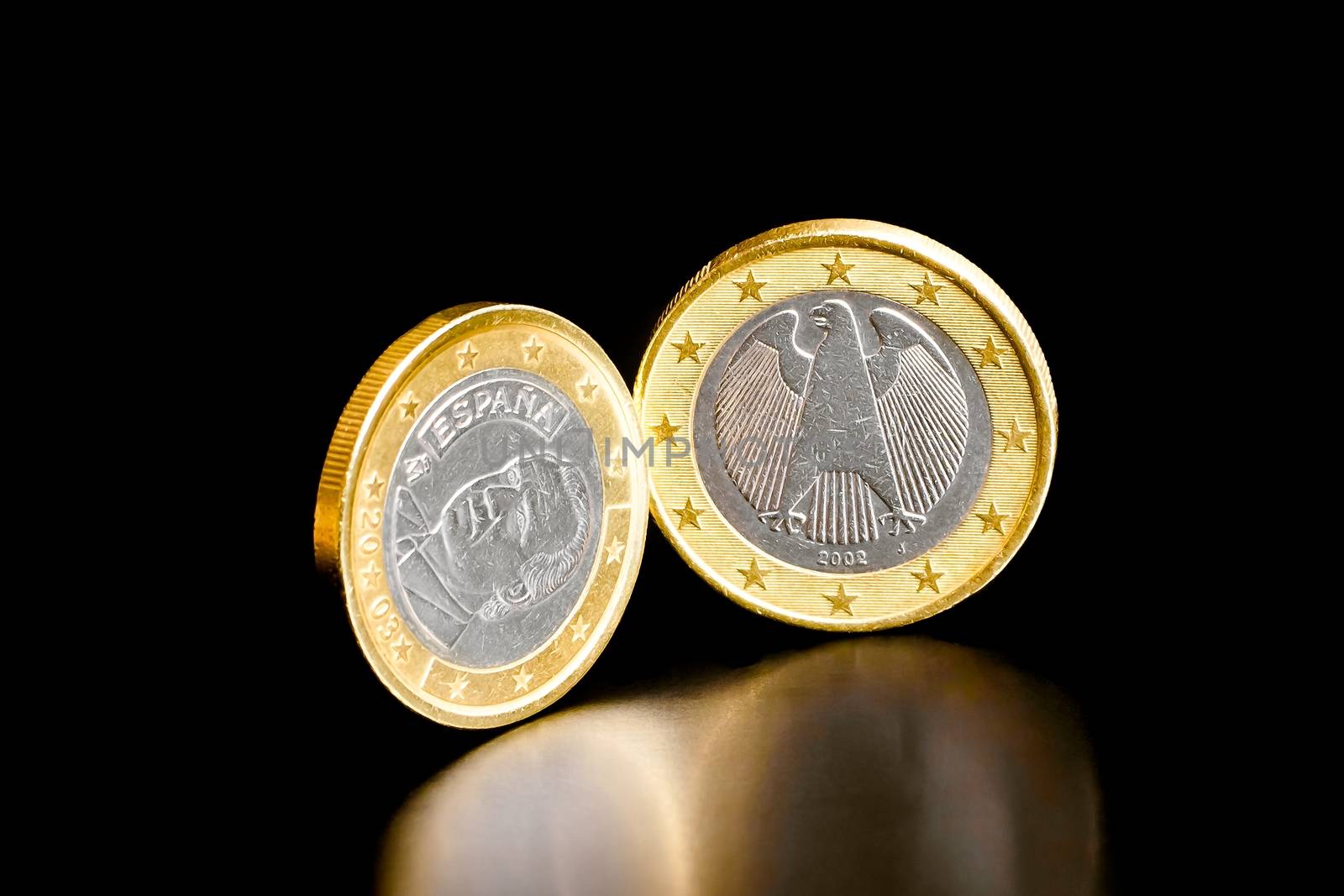 euro coin of germany and spain on black background