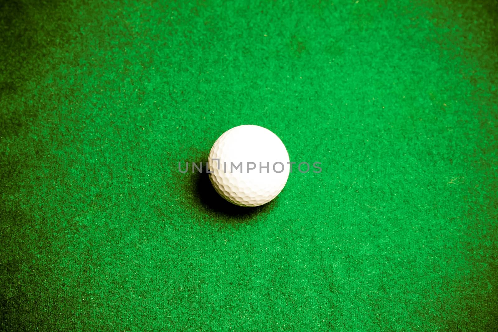 golf ball on grass background in vignette style