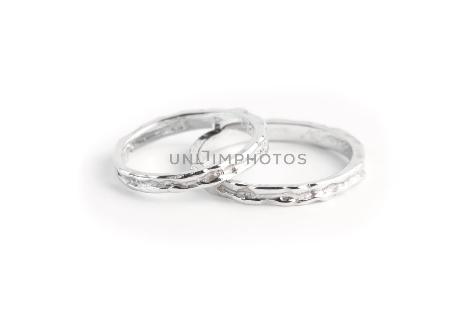 two white gold rings stacked together by donfiore