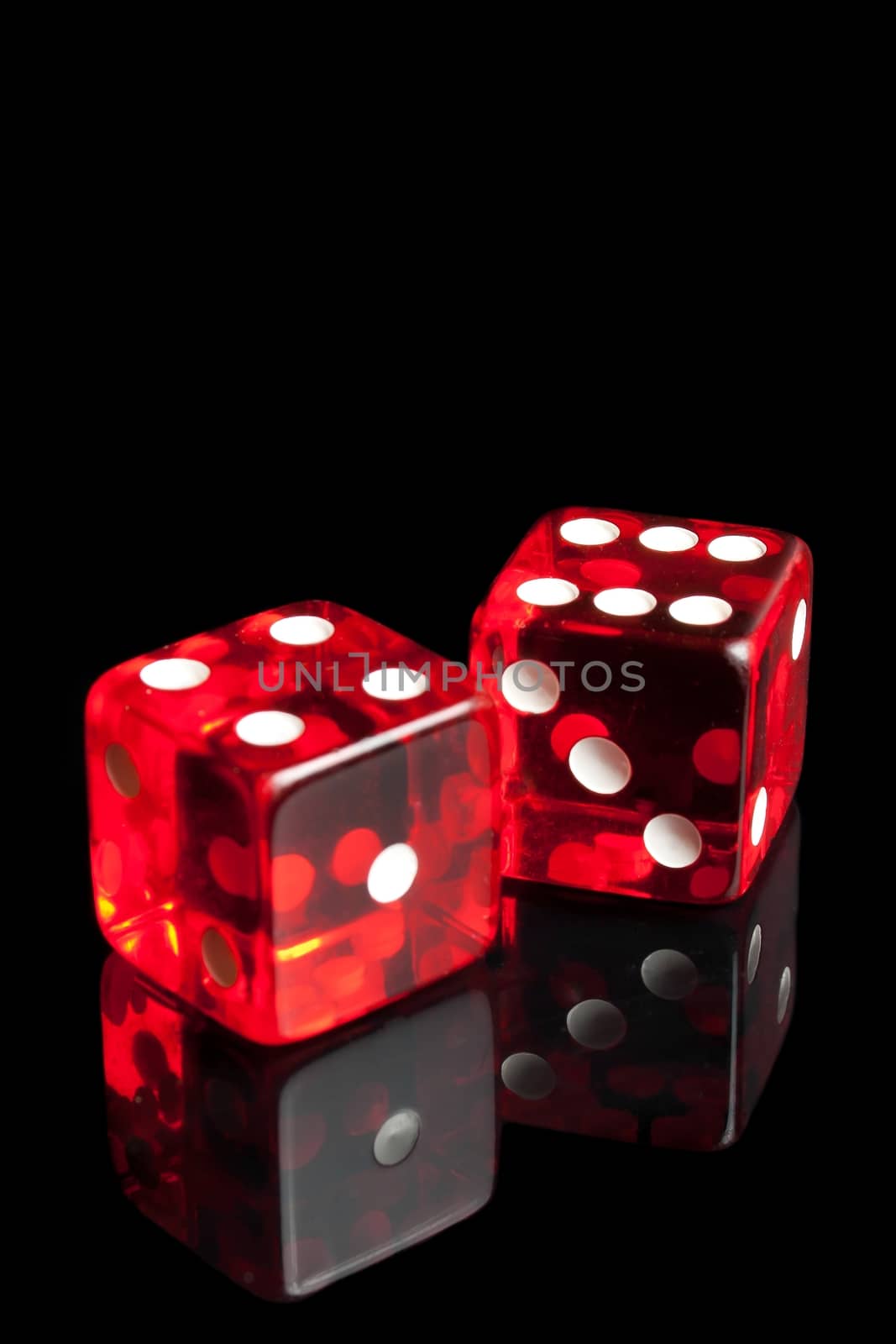 detail of red dice on transparent black background