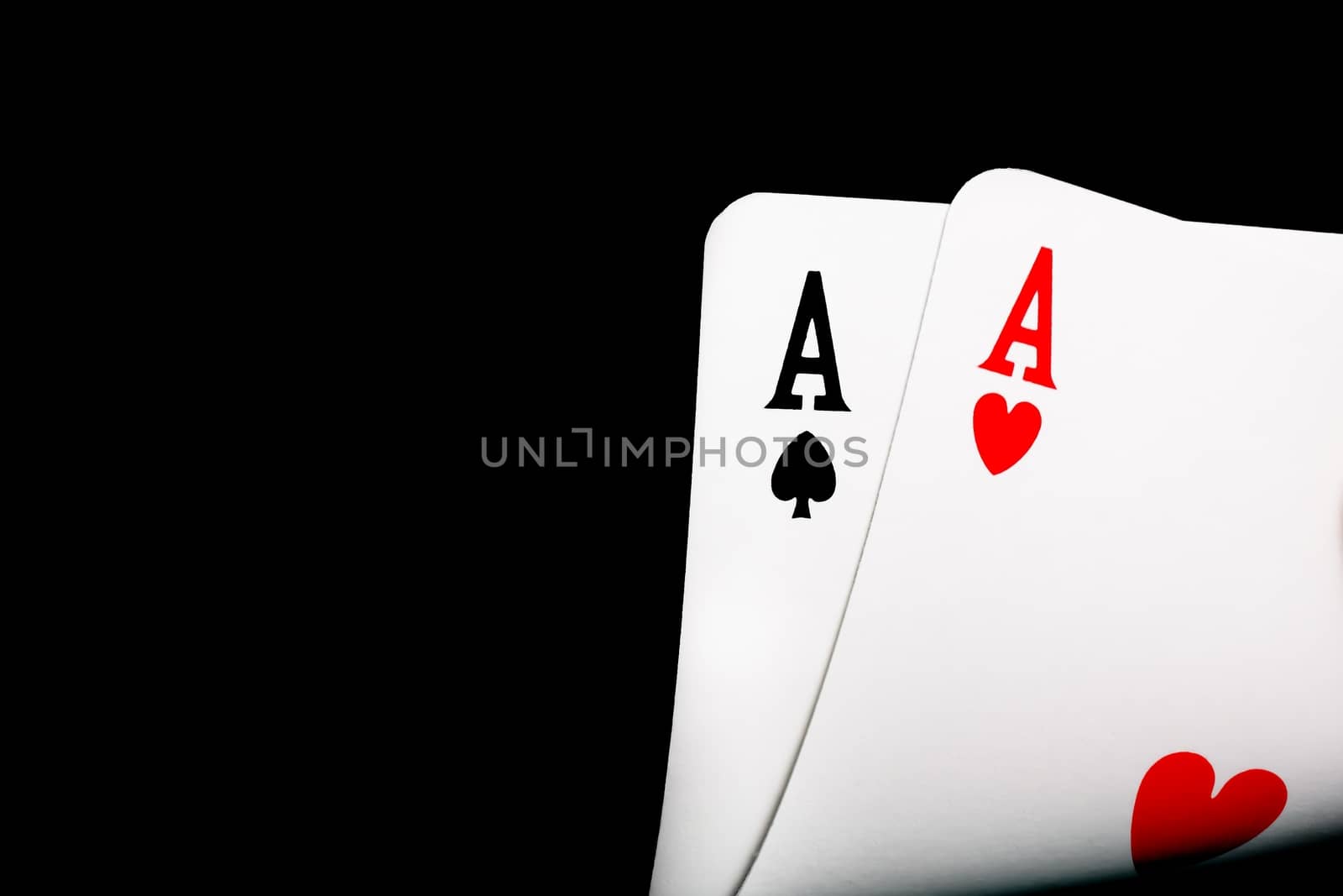 detail of winning aces on black background