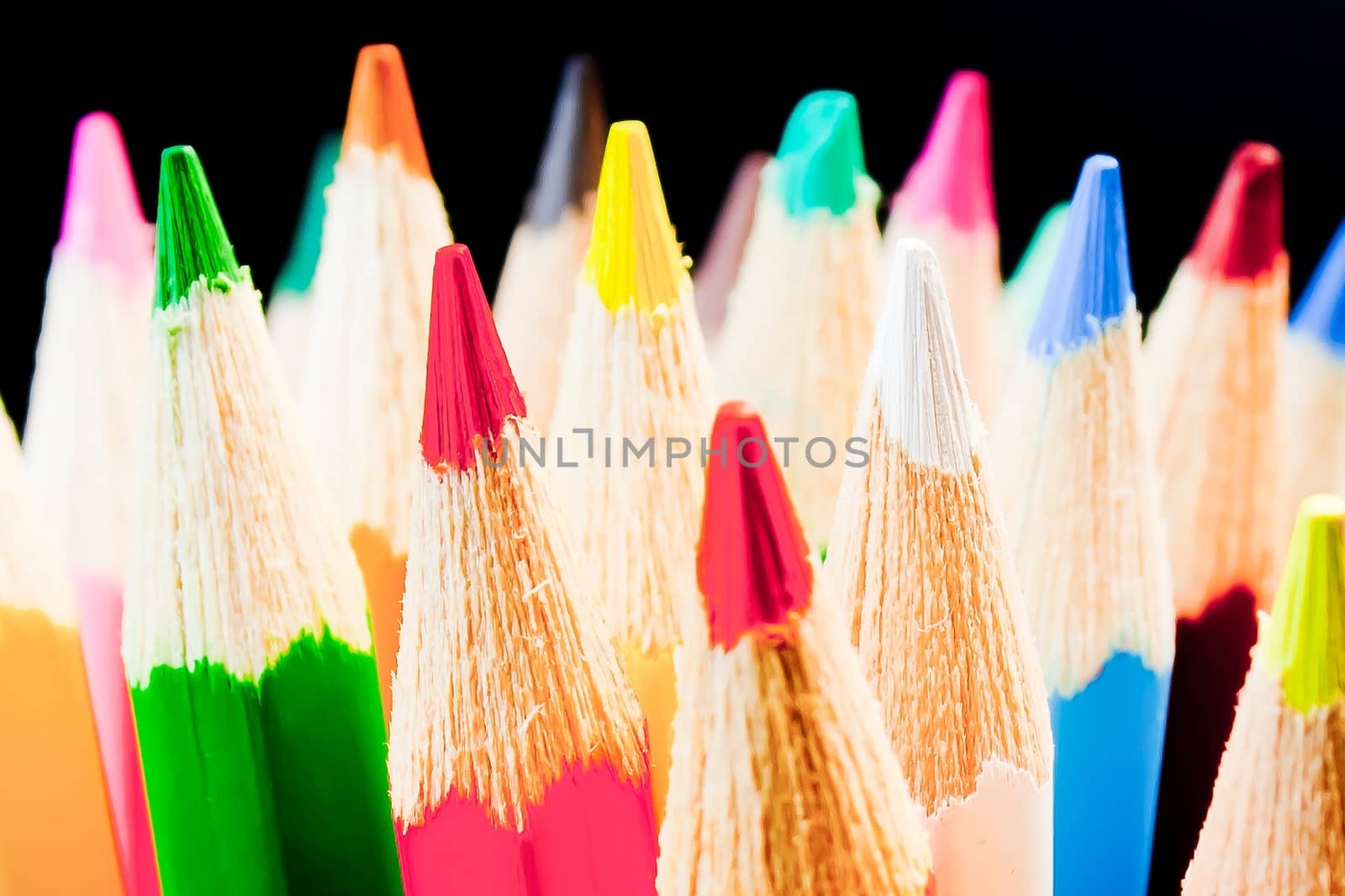 detail of colorful pencils on black background