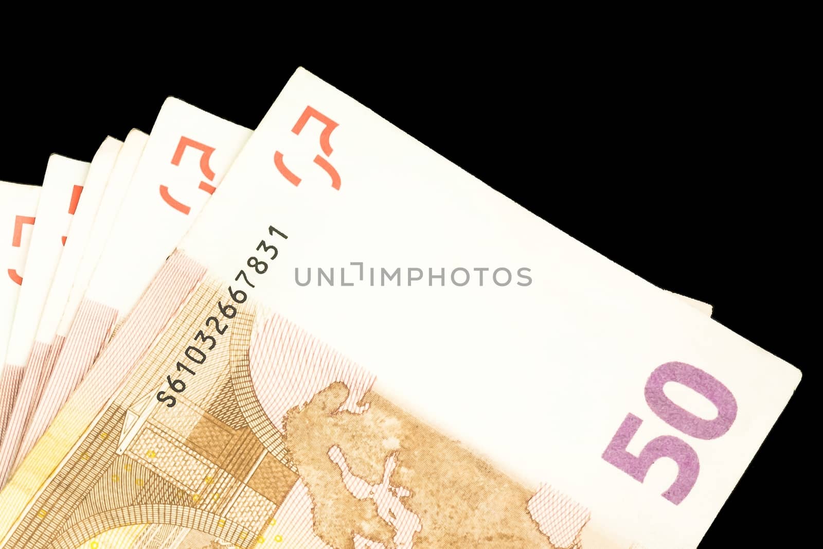 detail of 50 euro banknotes on black background