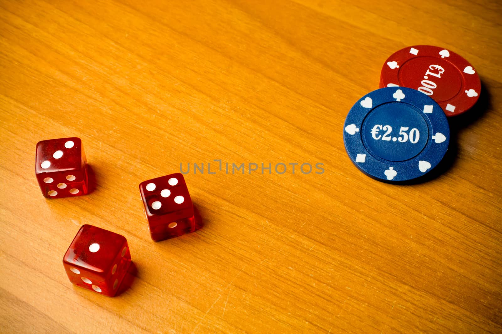 detail of dice and gambling chips on old wood