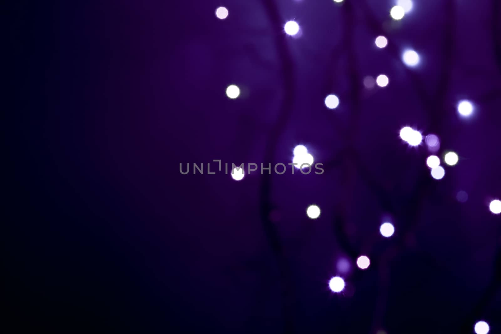 white defocused lights on abstract  violet background