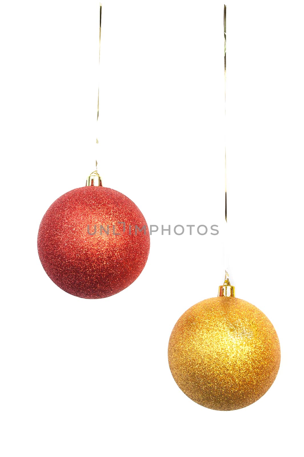 gold and red Christmas balls hanging on white background