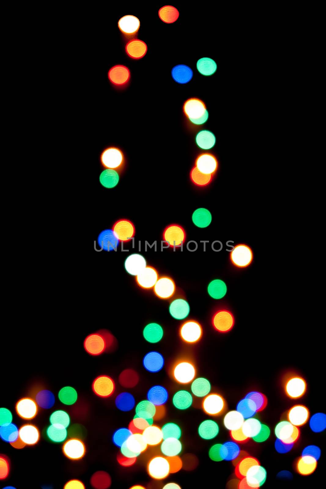 christmas tree with the lights defocused on black background