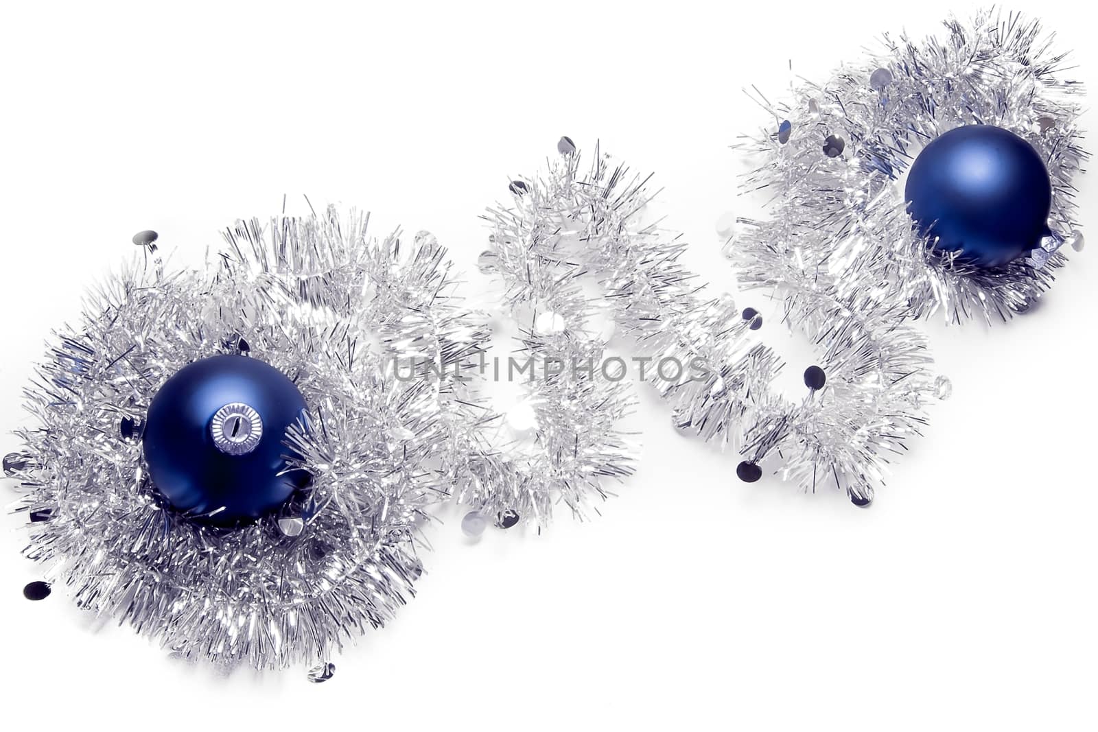 top view of the christmas decorations with blue balls on white background 