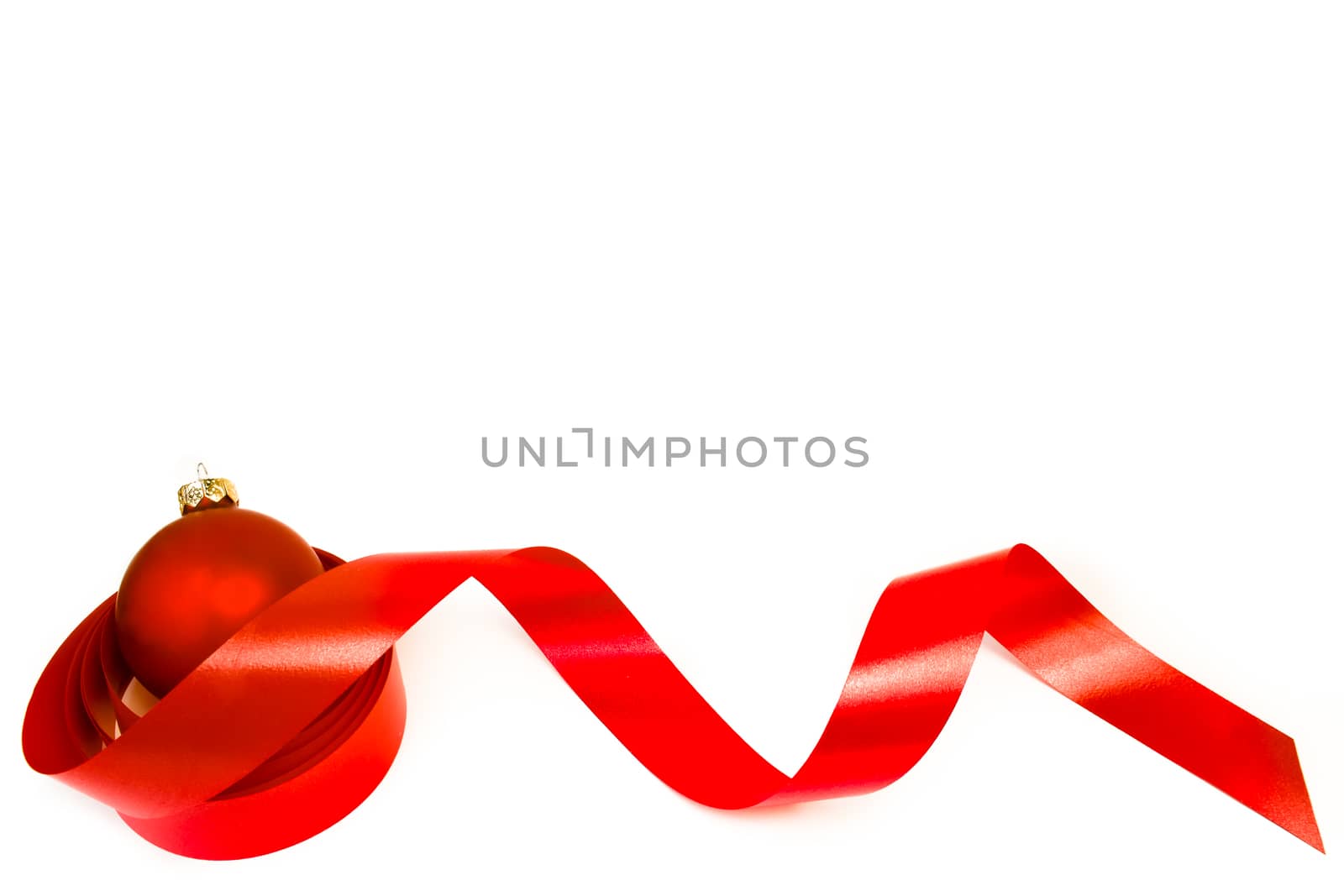 close up of a christmas decoration and red ball on white background - sample space text