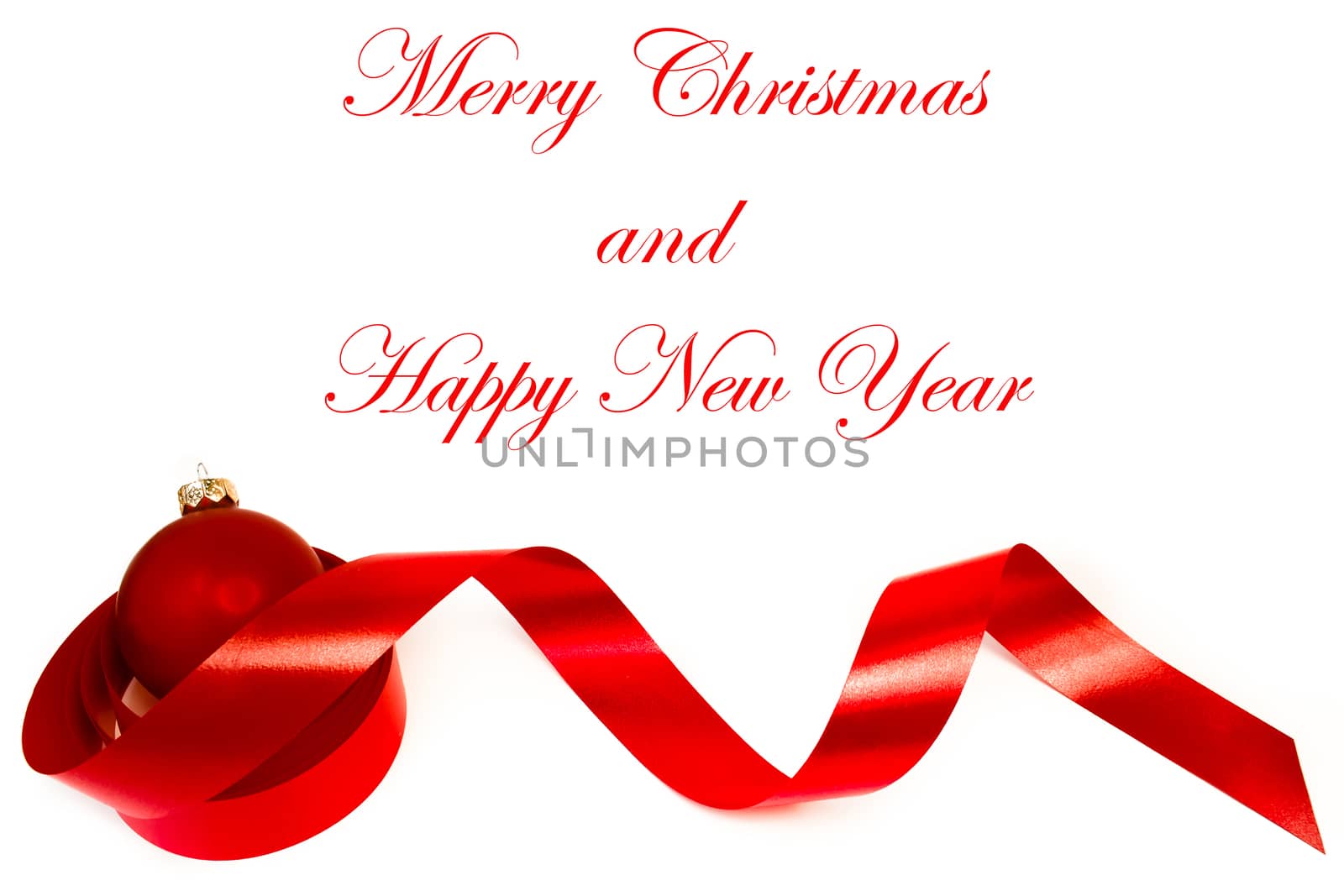 close up of a christmas decoration and red ball on white background - sample space text