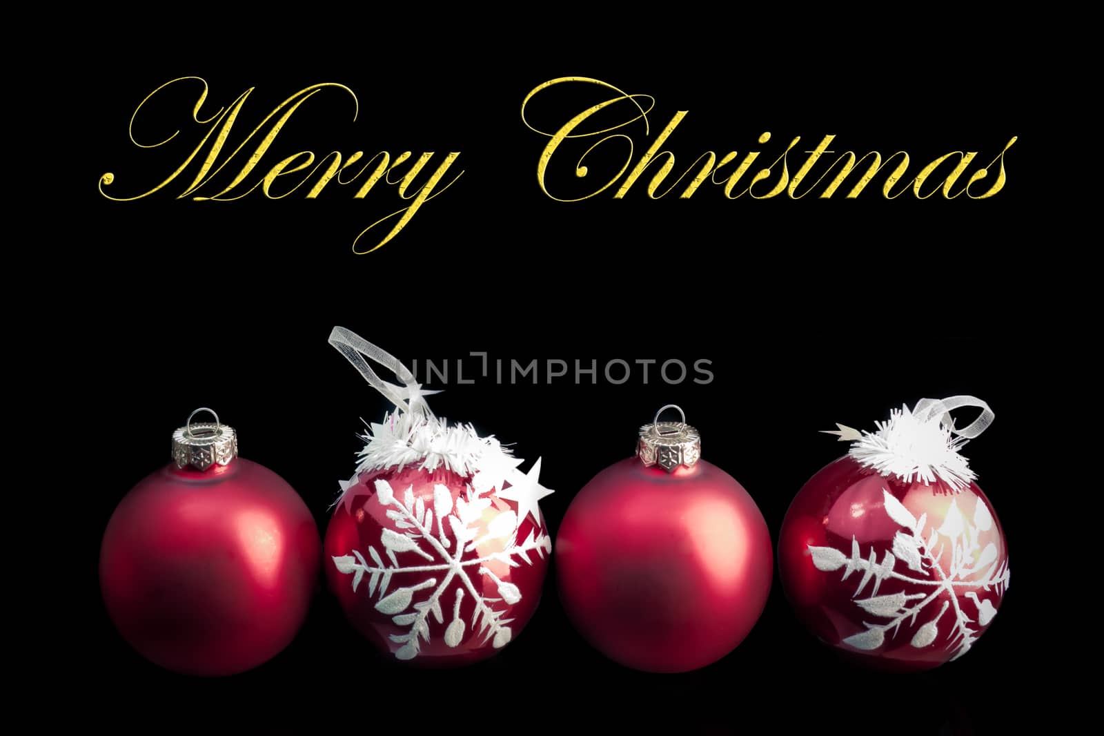 detail of four red decoration balls on black background with space for text