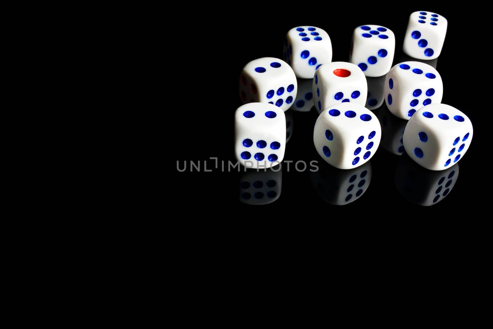 white dice in a corner on black background