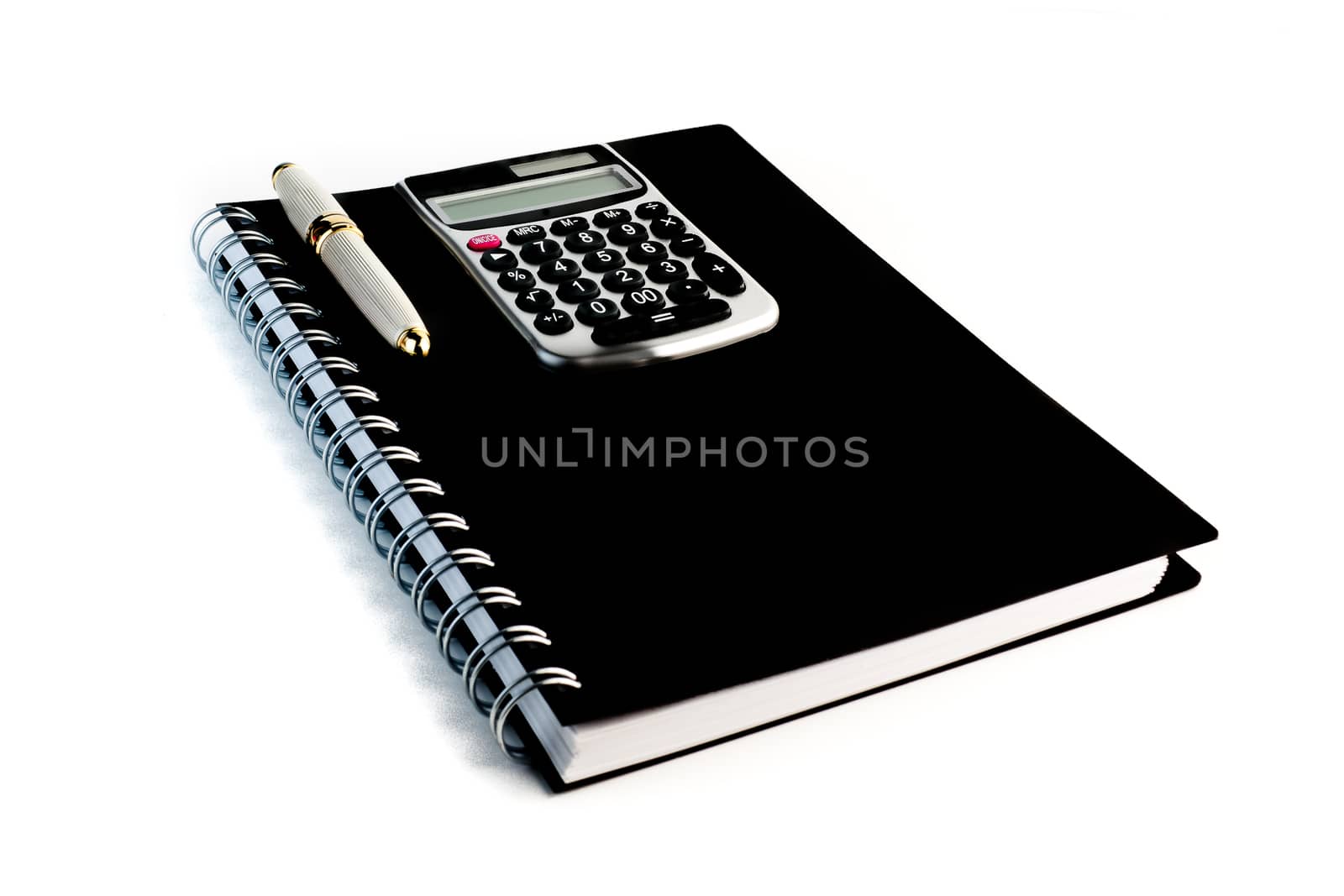 detail of a calculator with a pen on a notepad