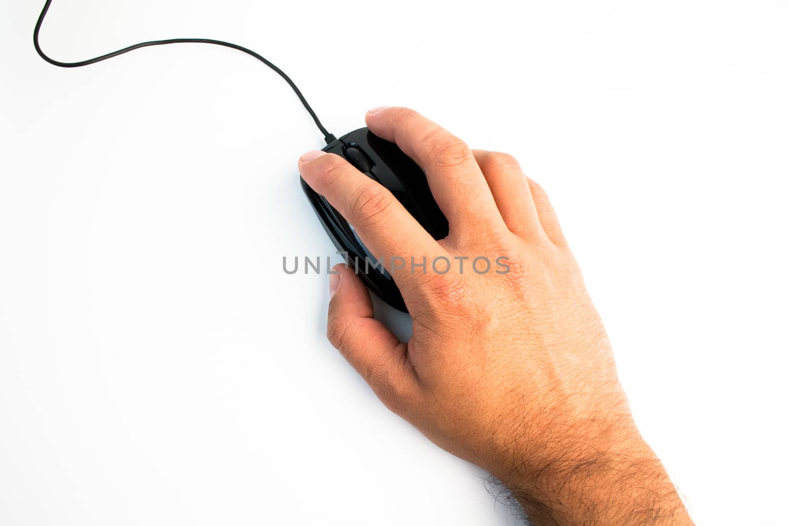 close up of black computer mouse with hand over white table