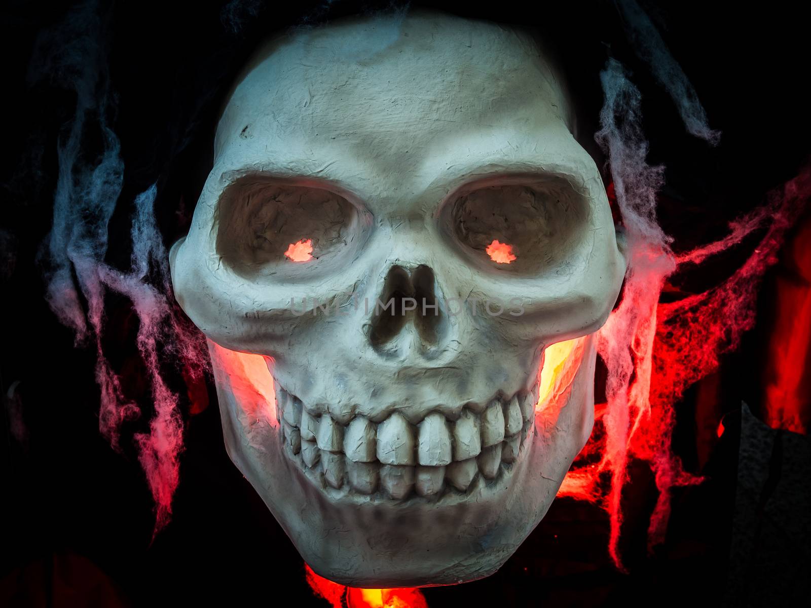 Scary Halloween skull bones with red light