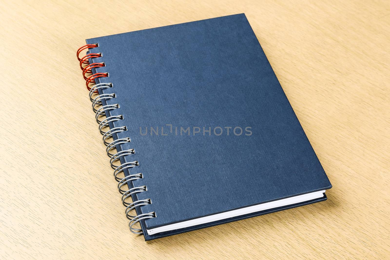 dark blue notebook on wooden table, business , education