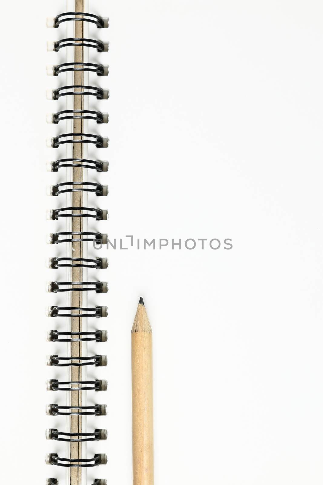 empty pages of opened notebook or sketchbook with pencil on wooden table, business, education, art