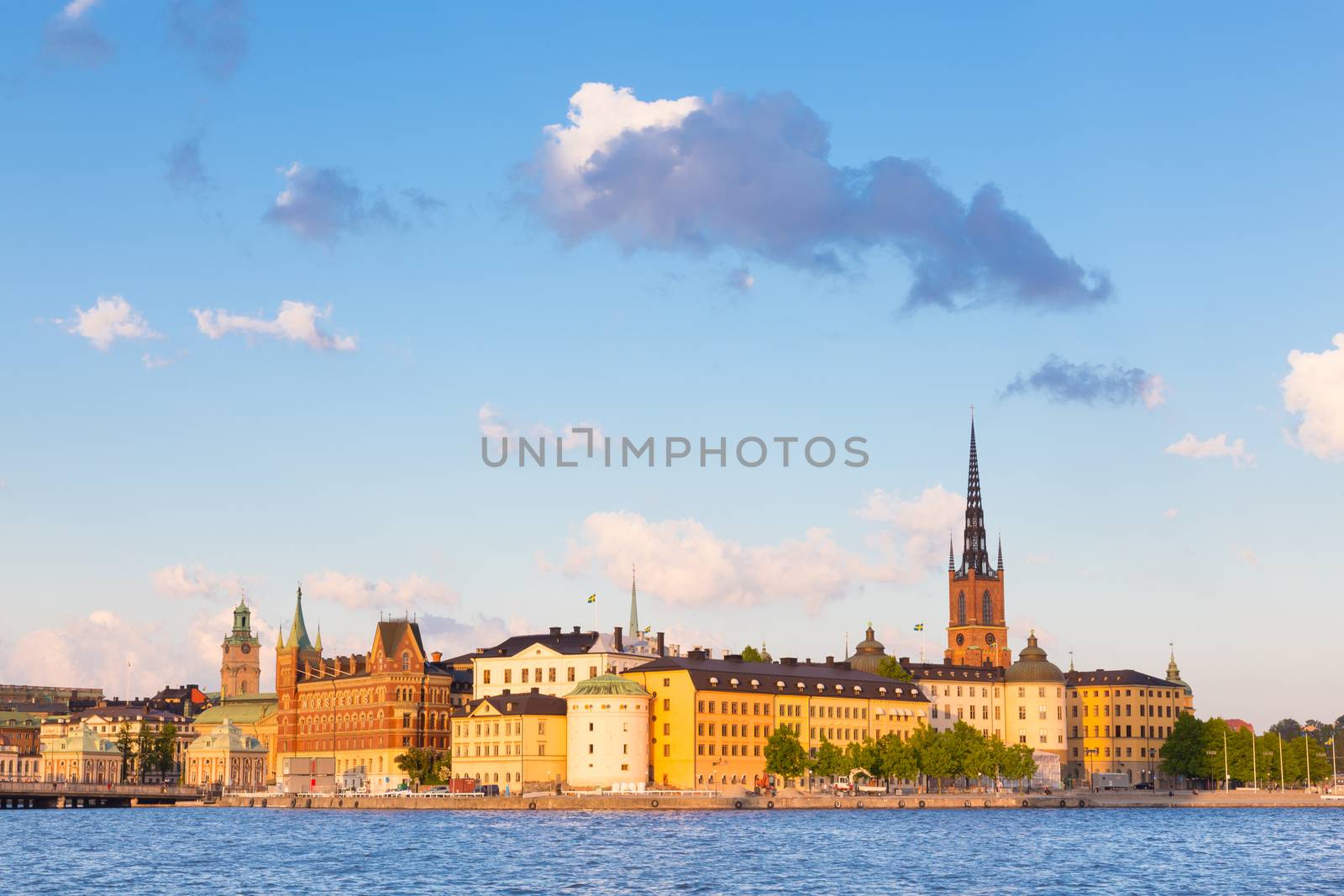 Panoramic view of swedish capital Stockholm in sunset. Gamla stan, old medieval downtown. Horisontal composition. Copy space.