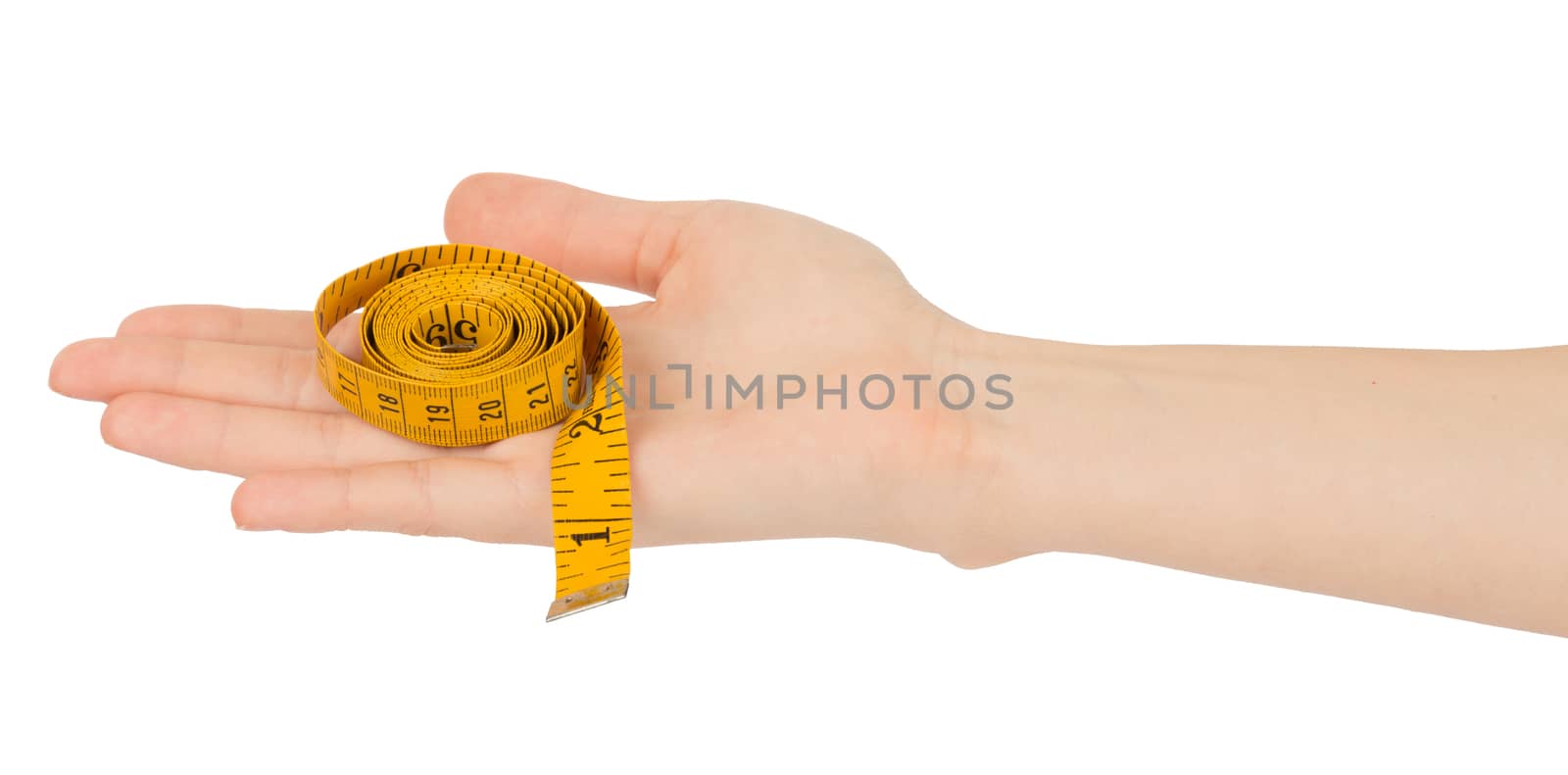 Humans hand holding tape measure on isolated white background