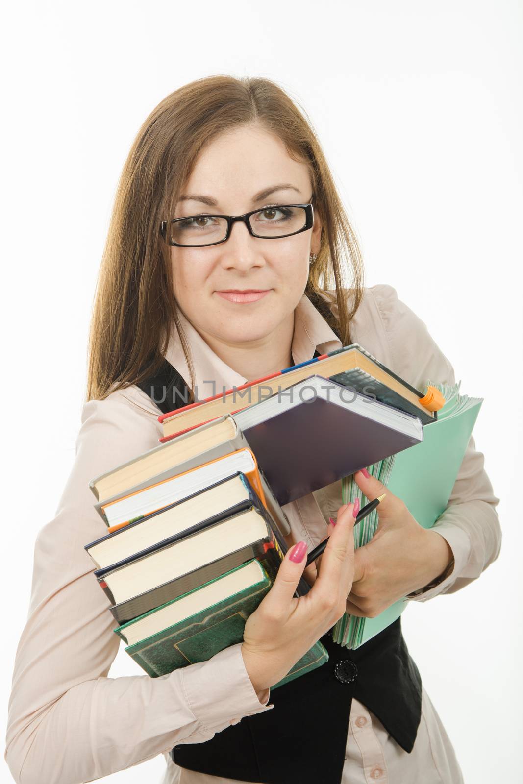 Europeans Portrait of a teacher with a bunch of textbooks and exercise books in the hands of