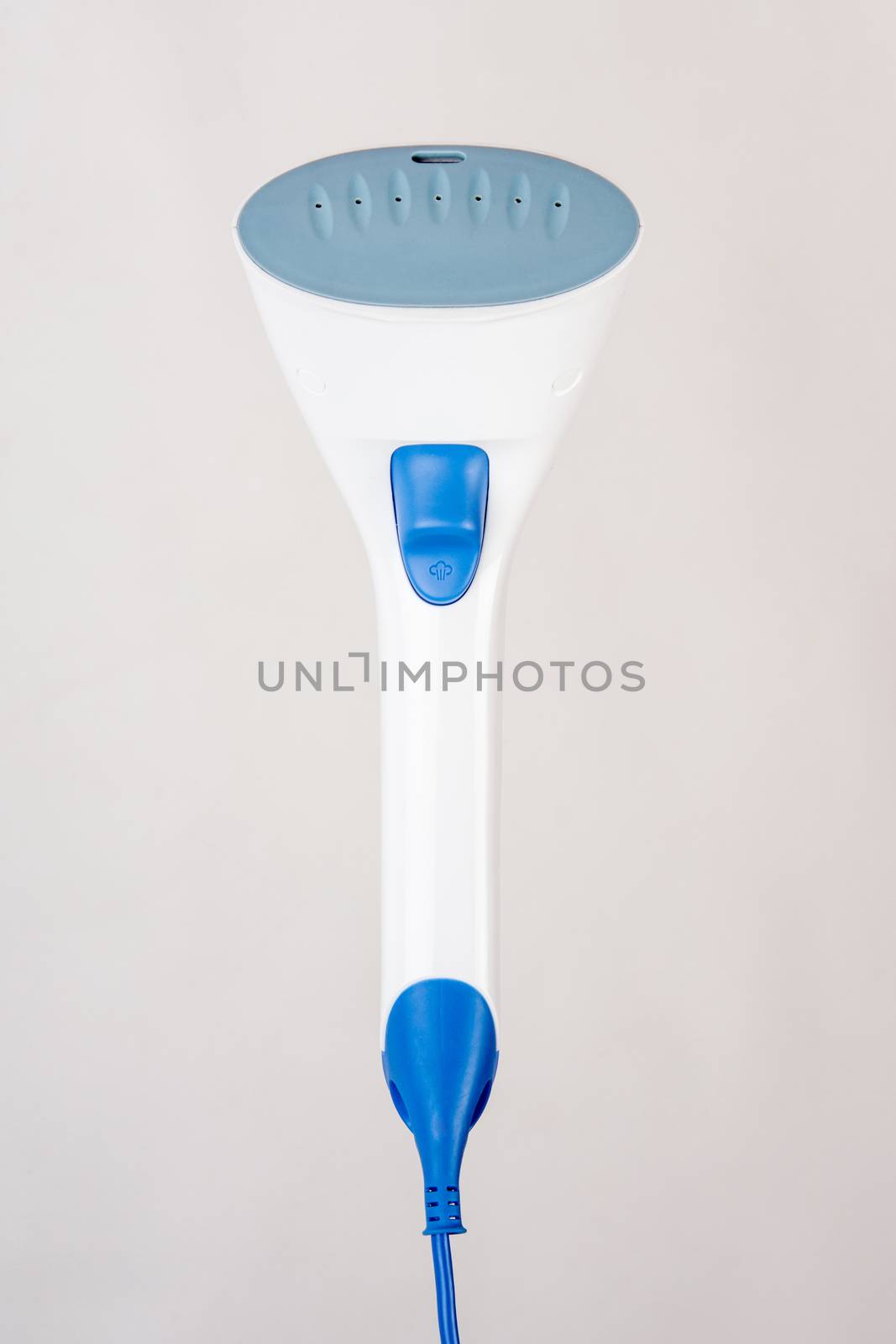 Image hand domestic garment steamer in phases, isolated on a light background