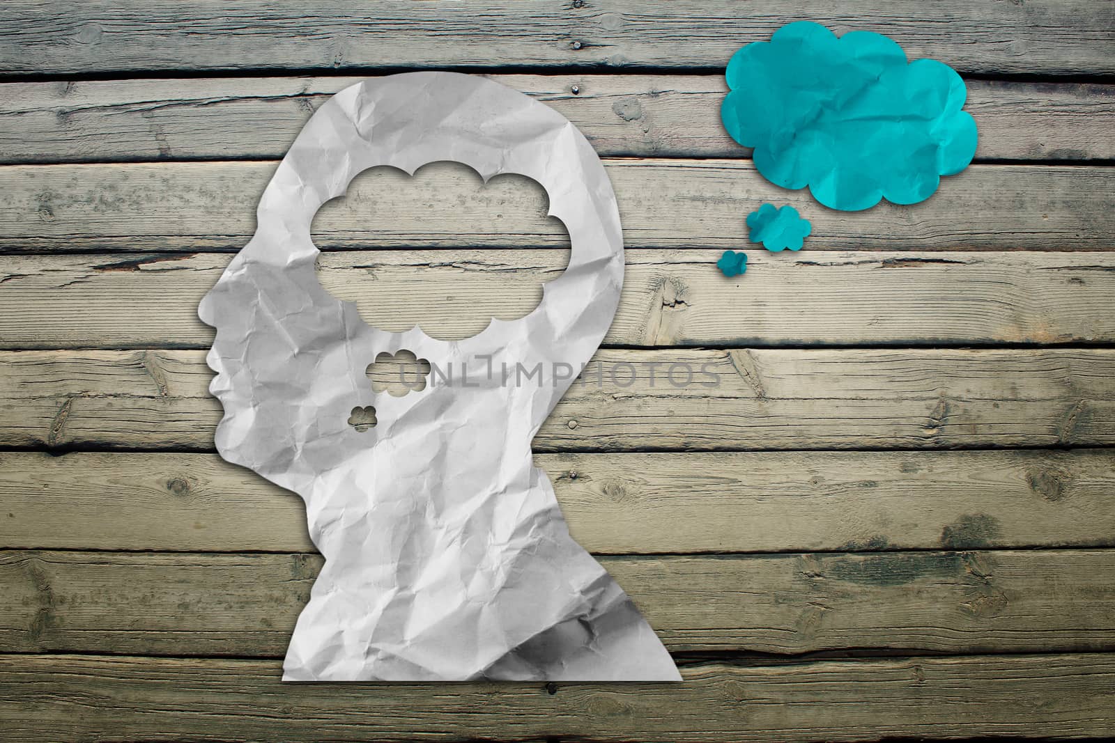 Paper humans head with cloud symbol by cherezoff