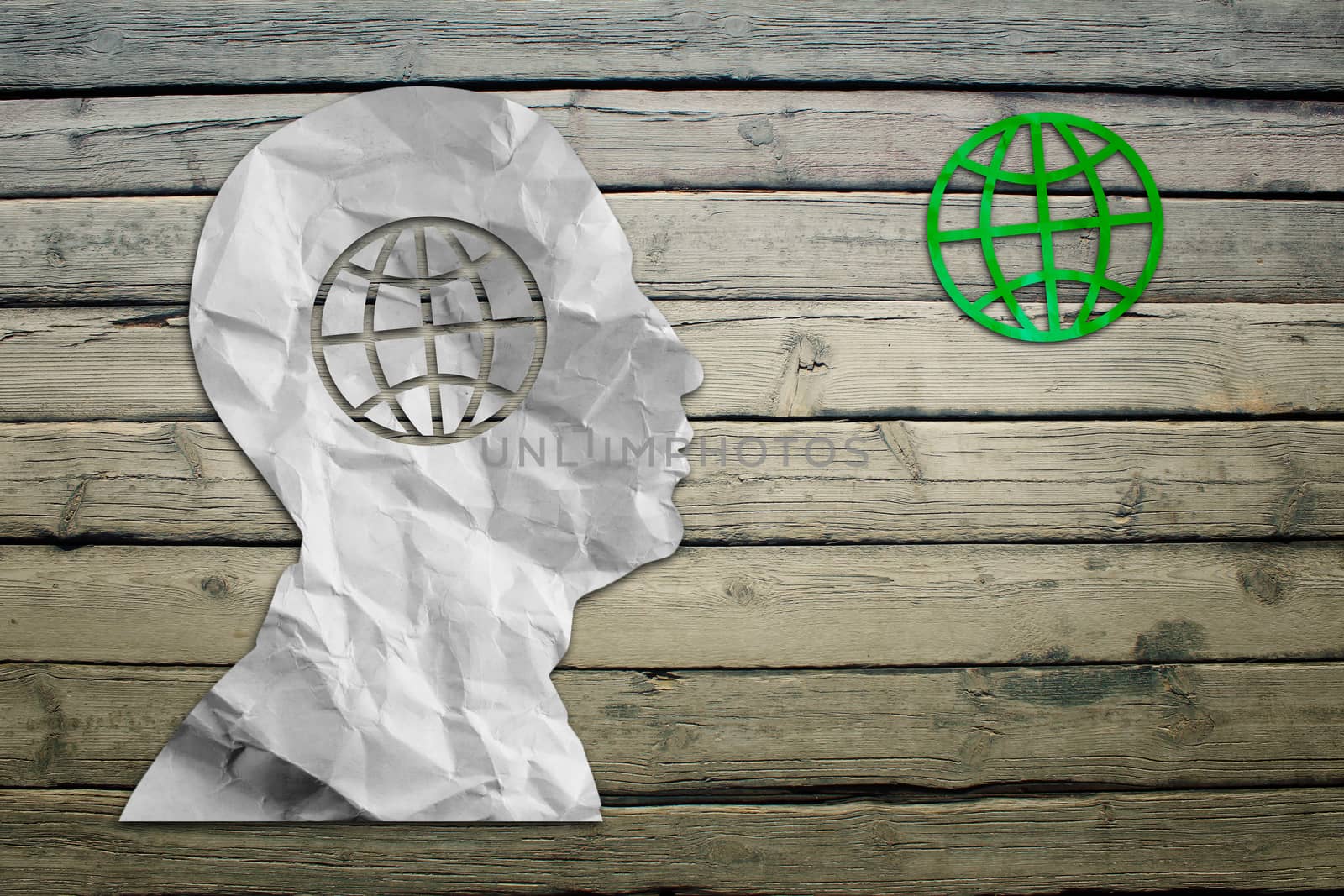 Paper humans head with globe symbol by cherezoff