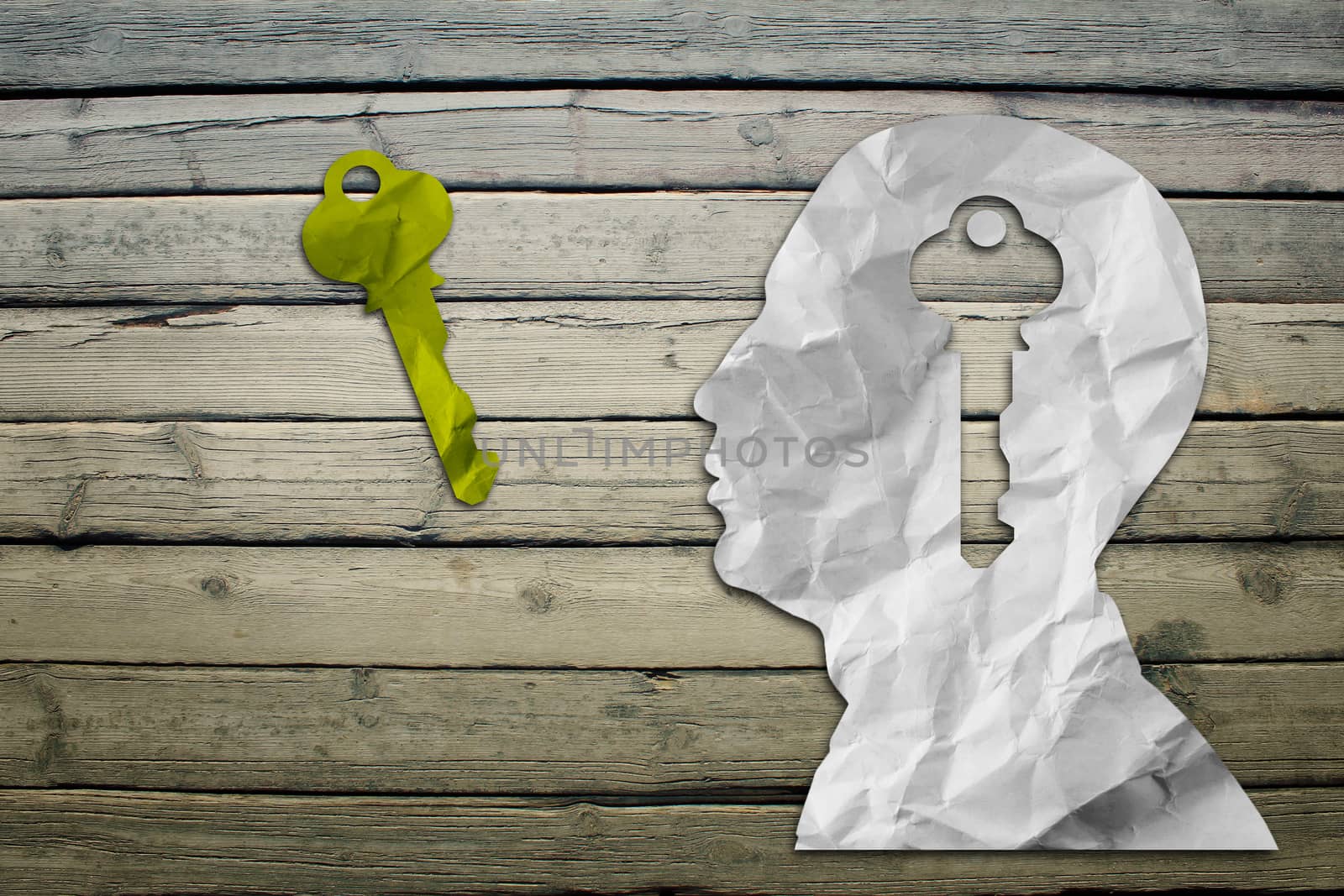 Paper humans head with key sign by cherezoff