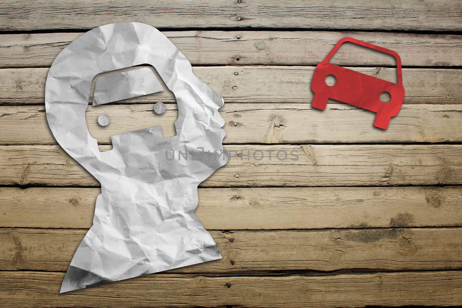 Paper humans head with car symbol by cherezoff