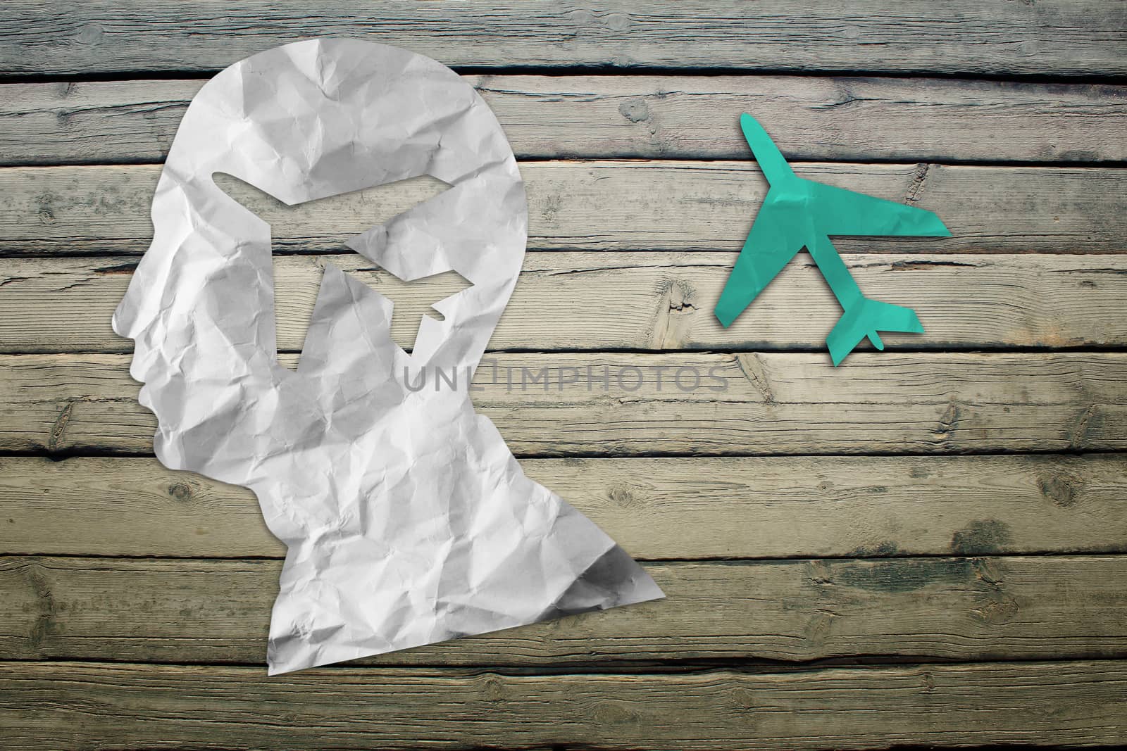 Paper humans head with jet symbol by cherezoff