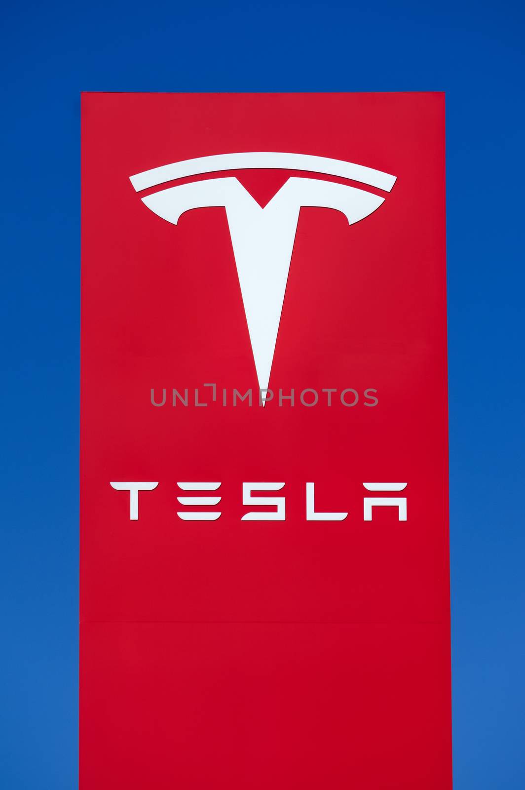 BUENA PARK, CA/USA - OCTOBER 10, 2015: Tesla Motors automobile sign. Tesla Motors, Inc. is an American automotive and energy storage company.